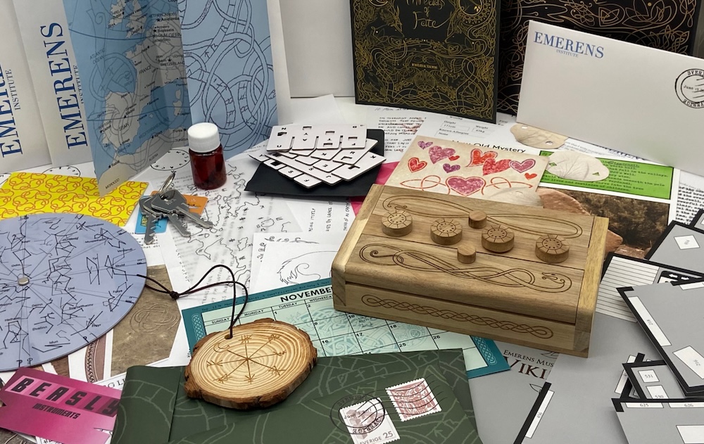An assortment of elegant puzzle piece, including a wooden medallion, and a wooden box with a snake carved into its face.